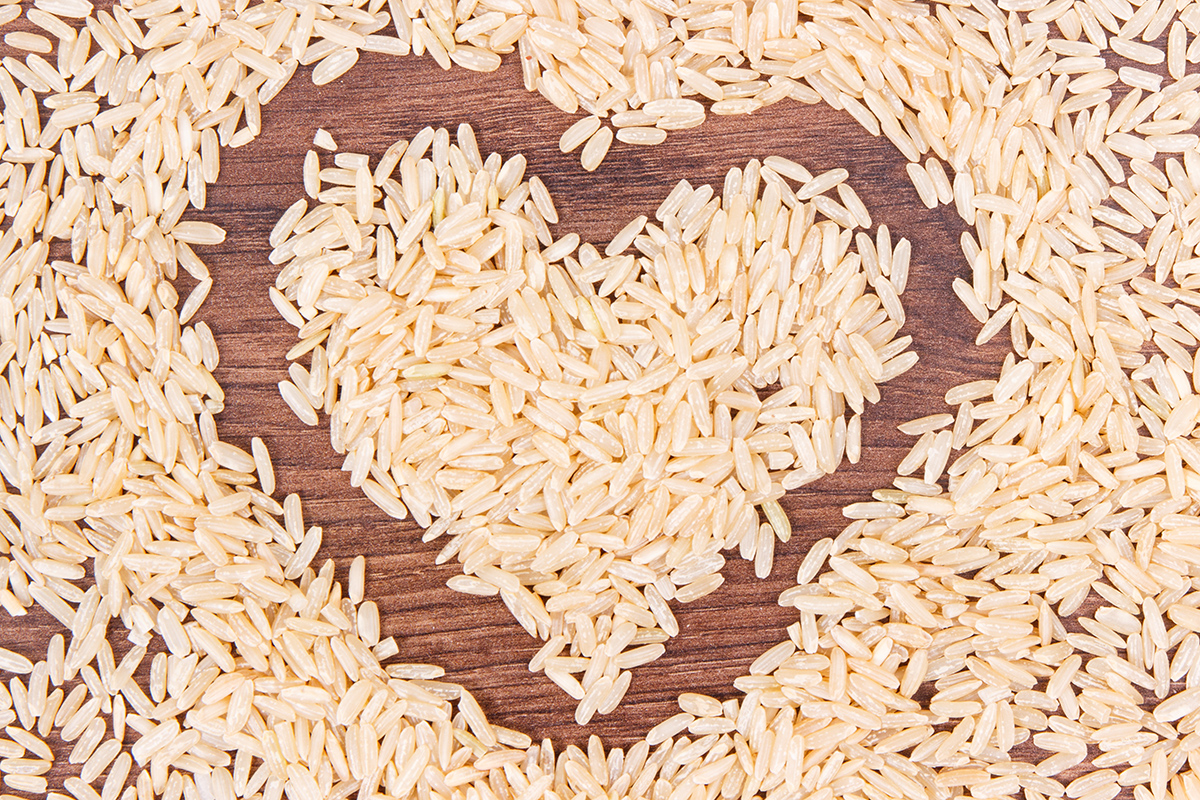heart shaped brown rice on rustic board 2021 08 26 18 15 53 utc