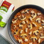 Paella de secretos y setas sin gluten